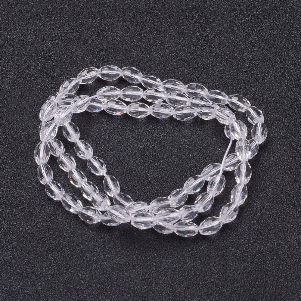 Clear Glass Beads  - Faceted Oval - 6x4mm - Appx 65 per strand
