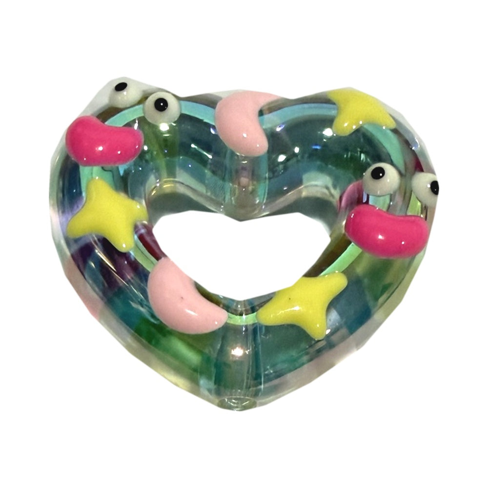 Clear acrylic heart with pink beans, yellow stars and eyes